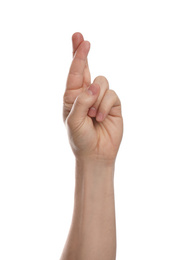 Photo of Man with crossed fingers against white background, closeup of hand