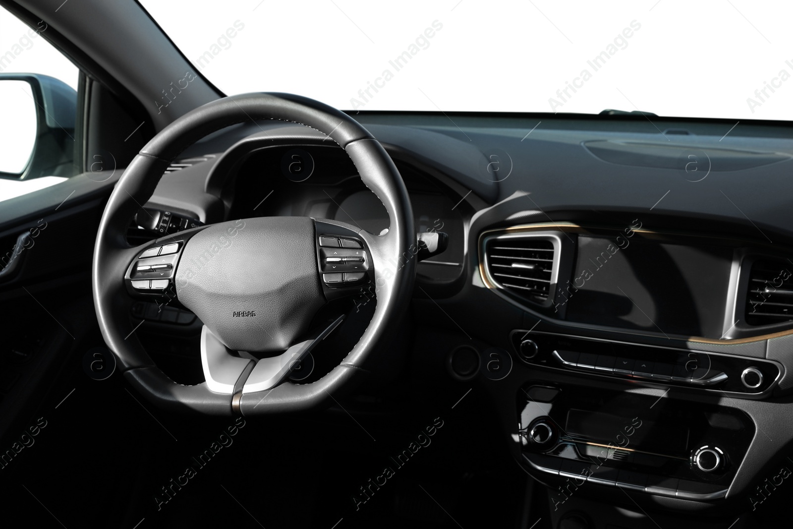 Image of Steering wheel and dashboard in modern car isolated on white