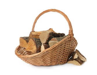 Photo of Wicker basket with firewood on white background