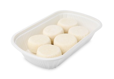 Photo of Container with uncooked cottage cheese pancakes isolated on white