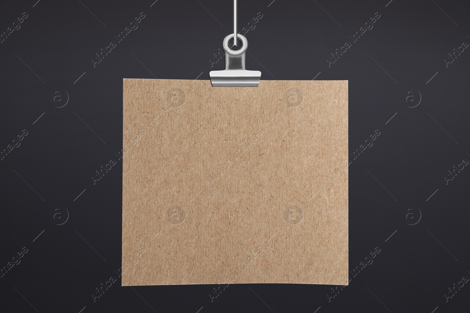 Image of Blank poster hanging near dark grey wall. Space for design