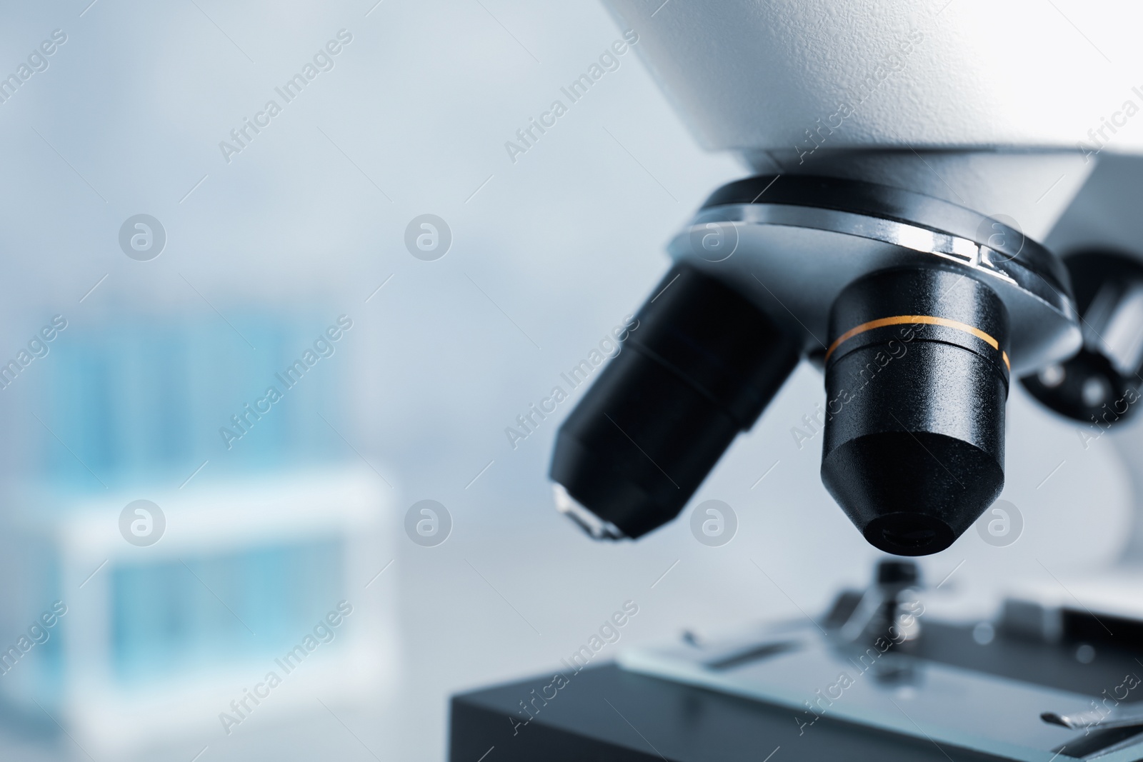 Photo of Closeup view of modern microscope in laboratory, space for text. Medical equipment