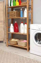 Photo of Laundry room interior with washing machine and furniture