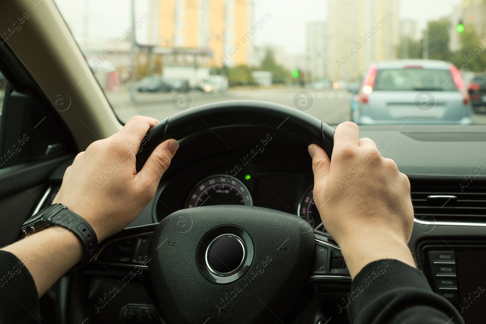 Photo of Man driving his car, closeup. Traffic rules