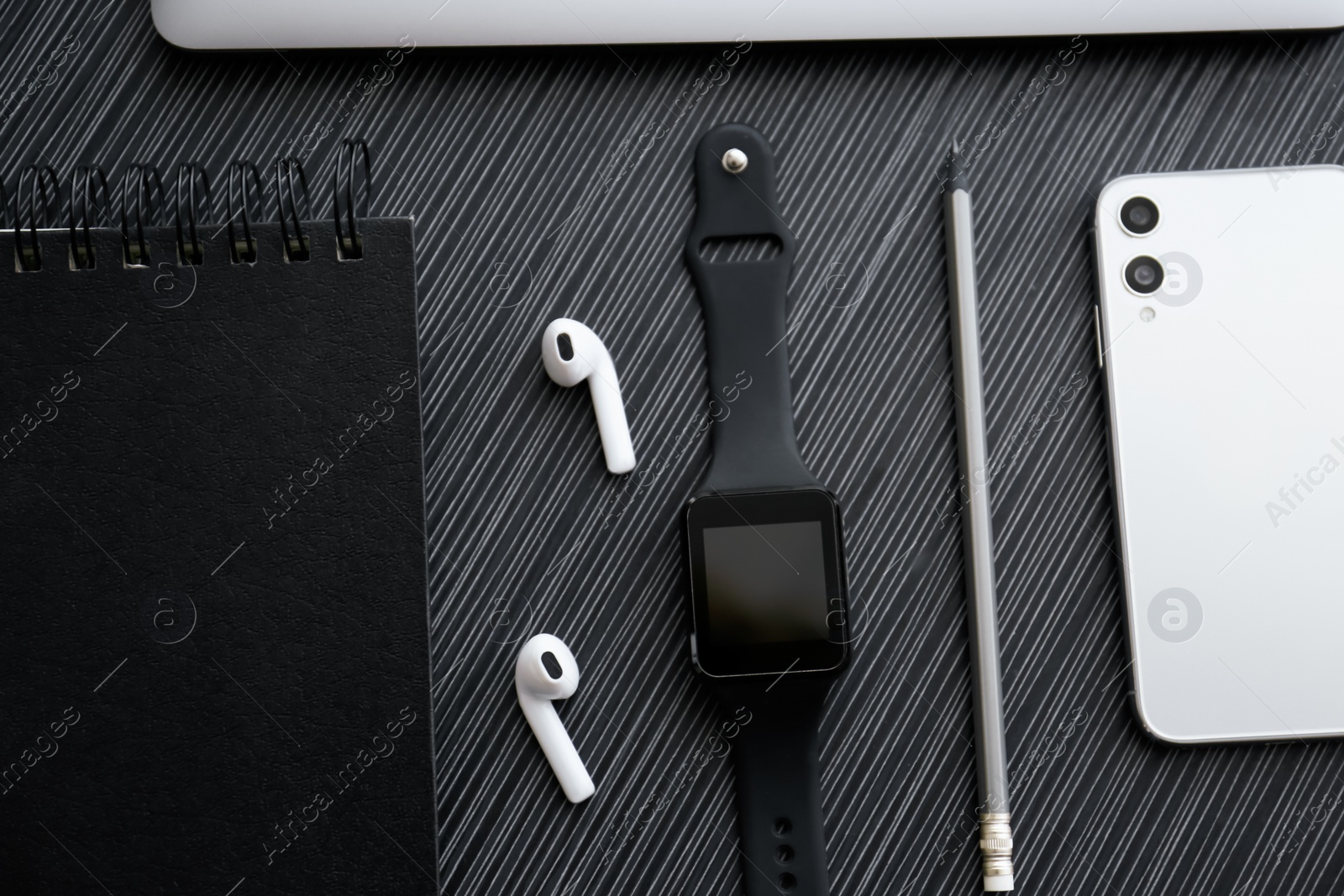 Flat lay composition with stylish smart watch on black table Photo of Flat lay composition with stylish smart watch on black table