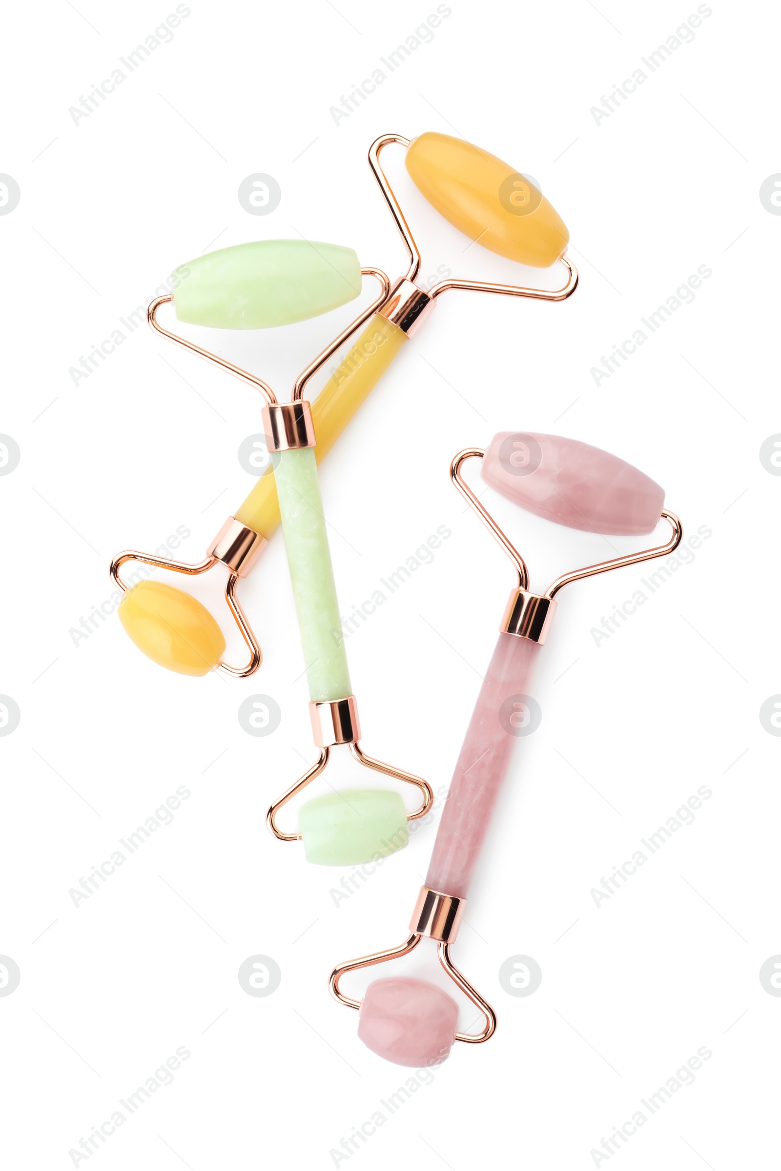 Photo of Different natural face rollers on white background, top view