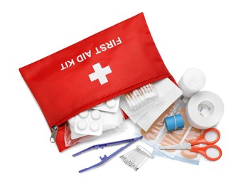 Photo of Red first aid kit with scissors, pins, cotton buds, pills, plastic forceps, medical plasters and elastic bandage isolated on white, top view
