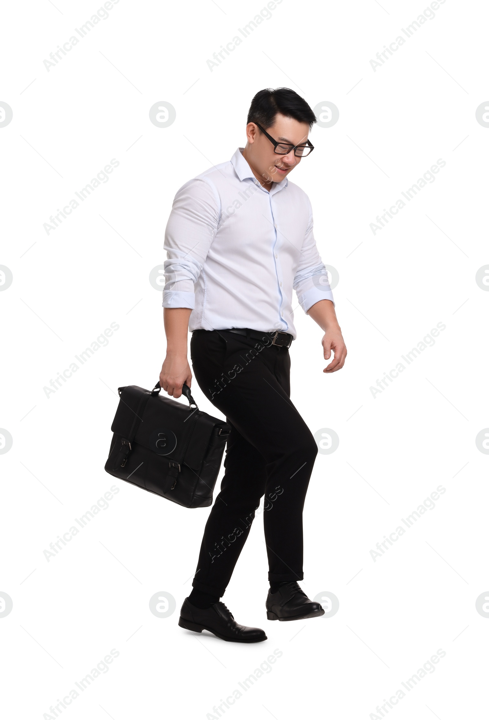 Photo of Businessman with briefcase walking on white background