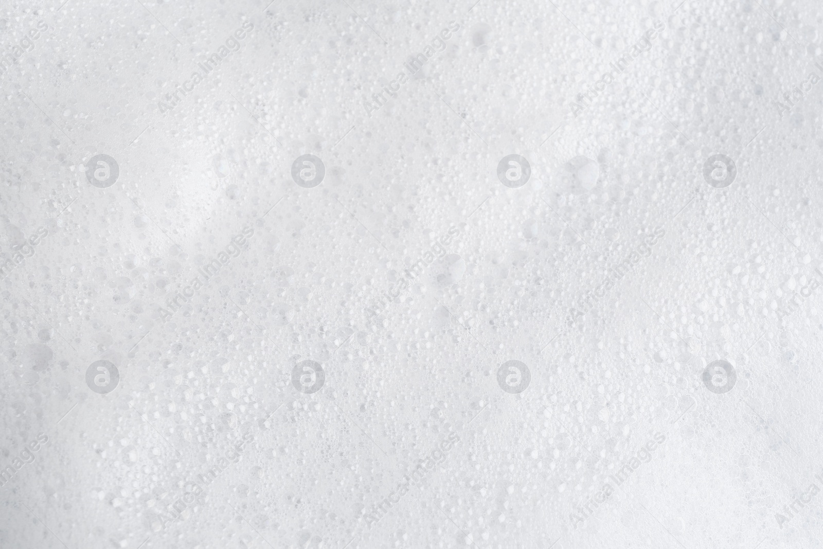 Photo of White fluffy foam as background, top view