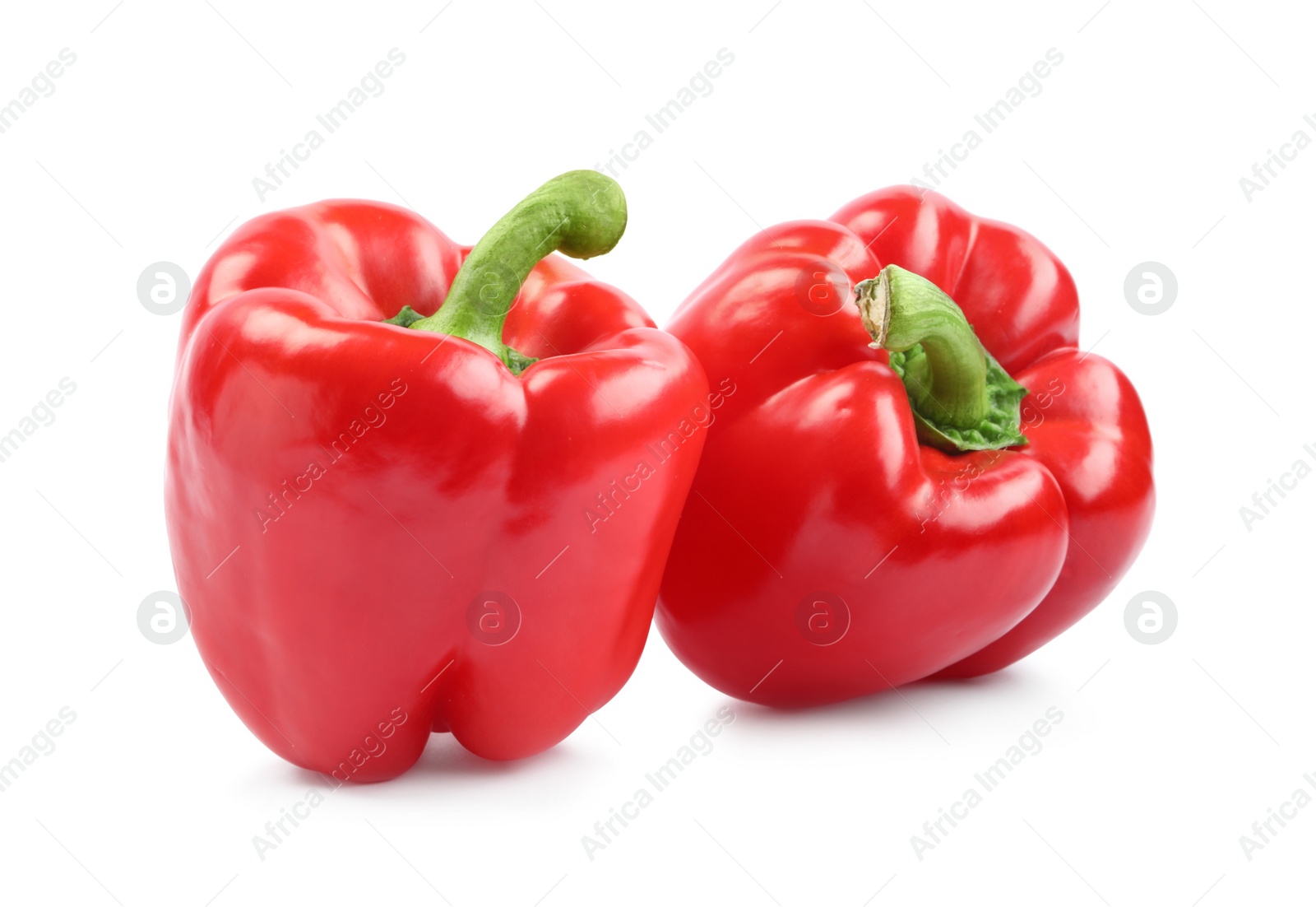 Photo of Ripe red bell peppers isolated on white