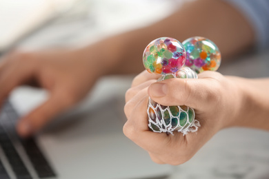 Woman squeezing colorful slime, closeup. Antistress toy