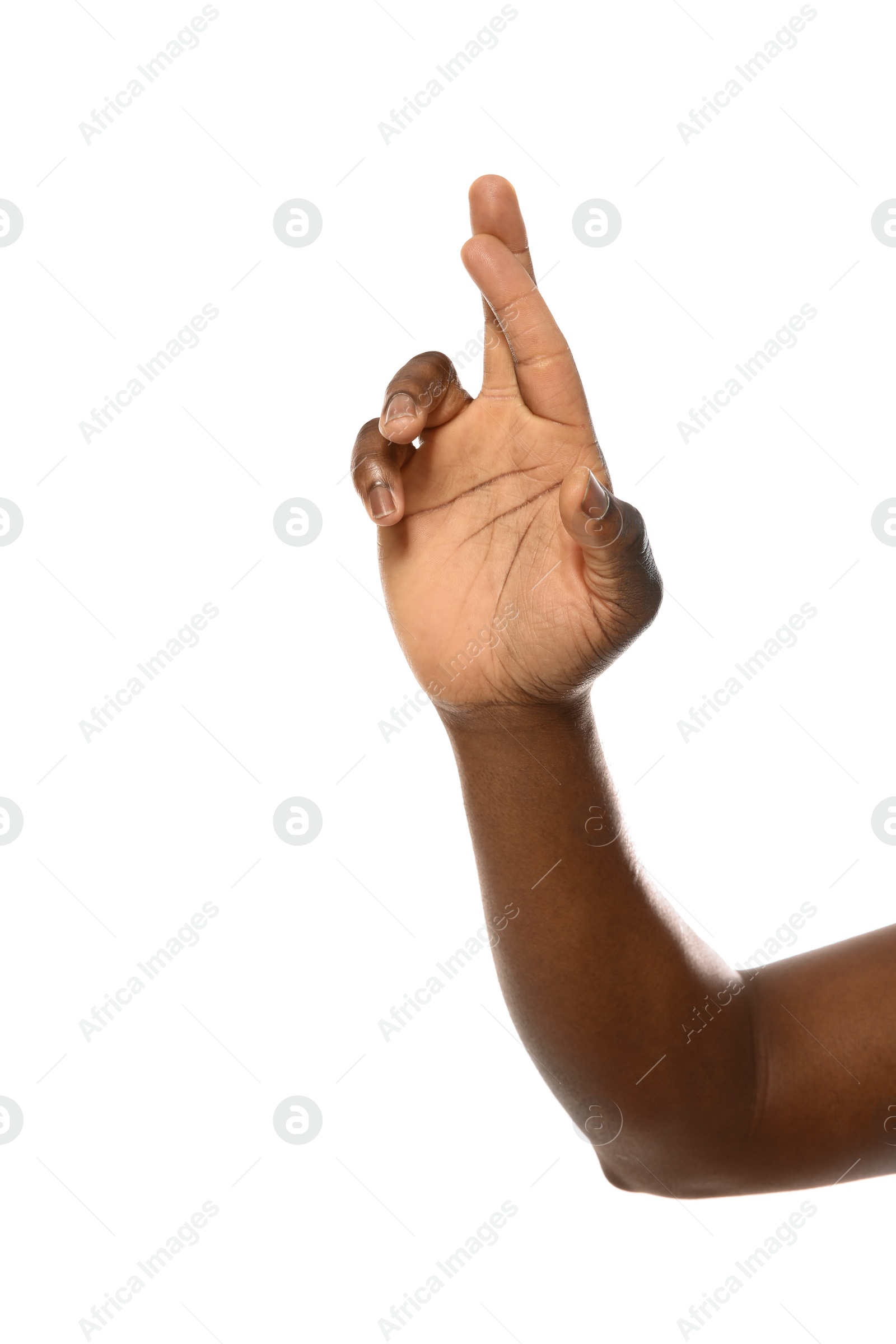 Photo of African-American man crossing fingers on white background, closeup