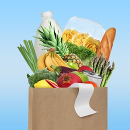 Image of Paper bag with different products and receipt on light blue background