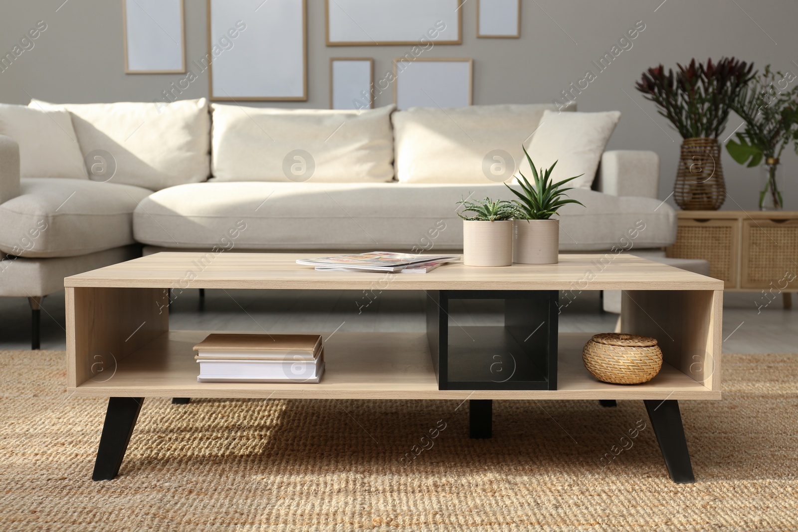 Photo of Beautiful living room interior with coffee table near sofa