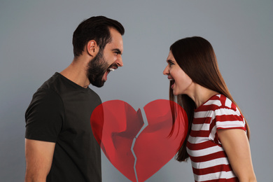 Image of Double exposure of torn paper heart and couple quarreling on grey background. Relationship problems
