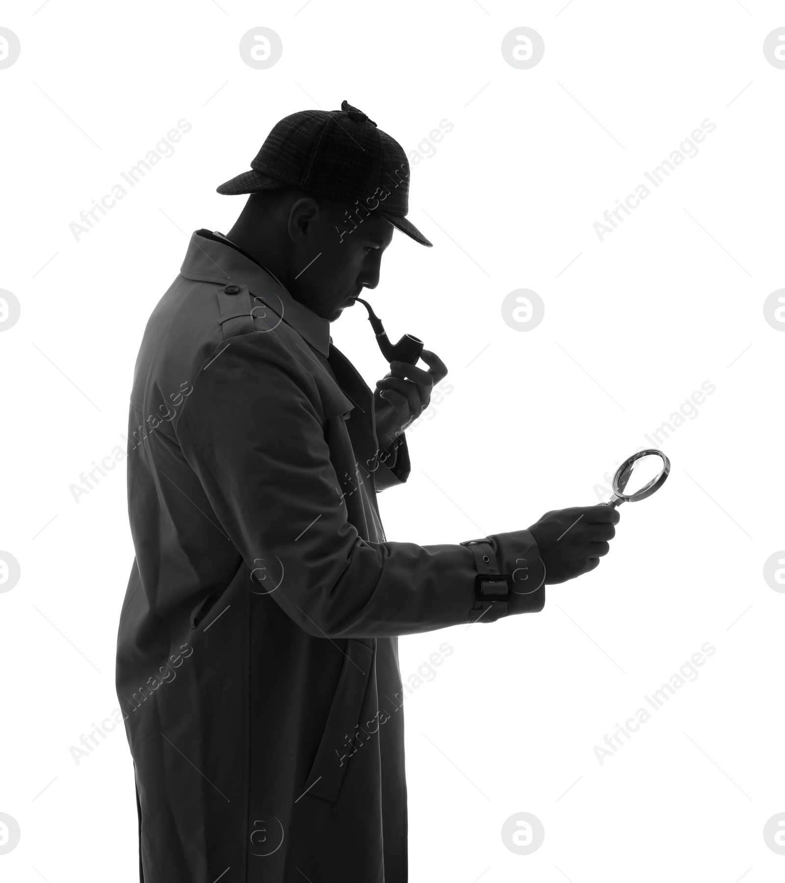 Photo of Old fashioned detective with smoking pipe and magnifying glass on white background