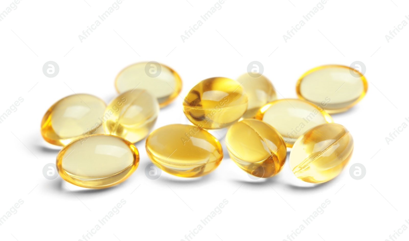 Photo of Cod liver oil pills on white background