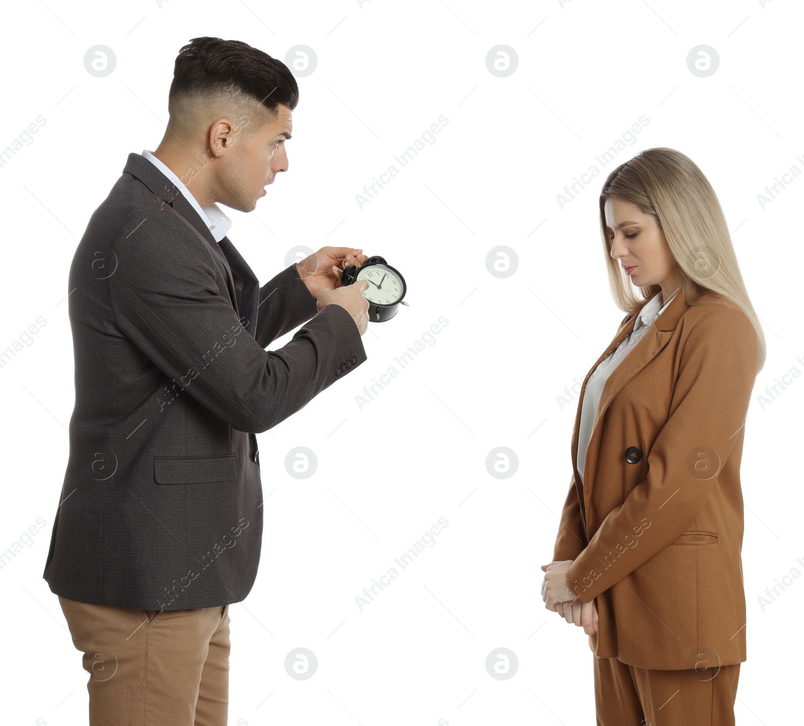 Photo of Businessman with alarm clock scolding employee for being late on white background