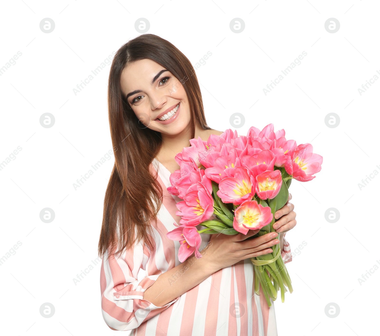 Photo of Portrait of smiling young girl with beautiful tulips on white background. International Women's Day