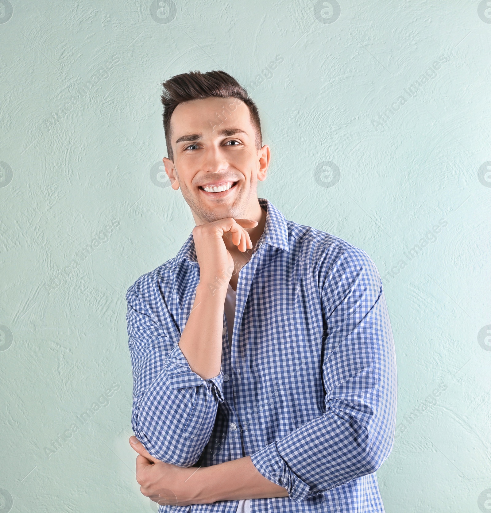 Photo of Charming young man on light background