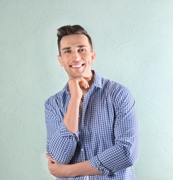 Photo of Charming young man on light background