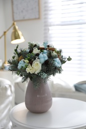 Beautiful wedding winter bouquet on table indoors