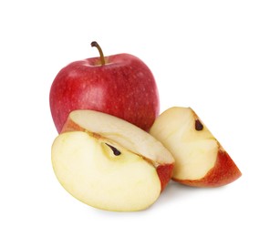 Photo of Whole and cut apples on white background