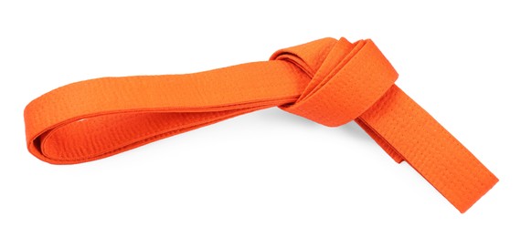 Photo of Orange karate belt isolated on white, top view. Martial arts uniform