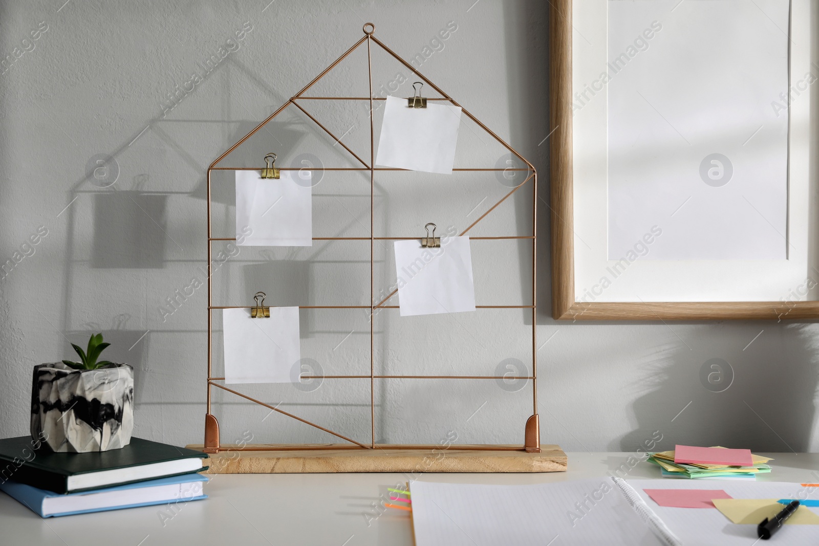 Photo of Memo board with notes on table in home office