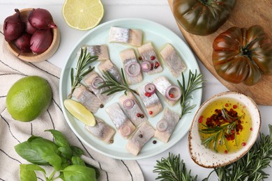 Photo of Tasty fish with spices, products and marinade on light table, flat lay