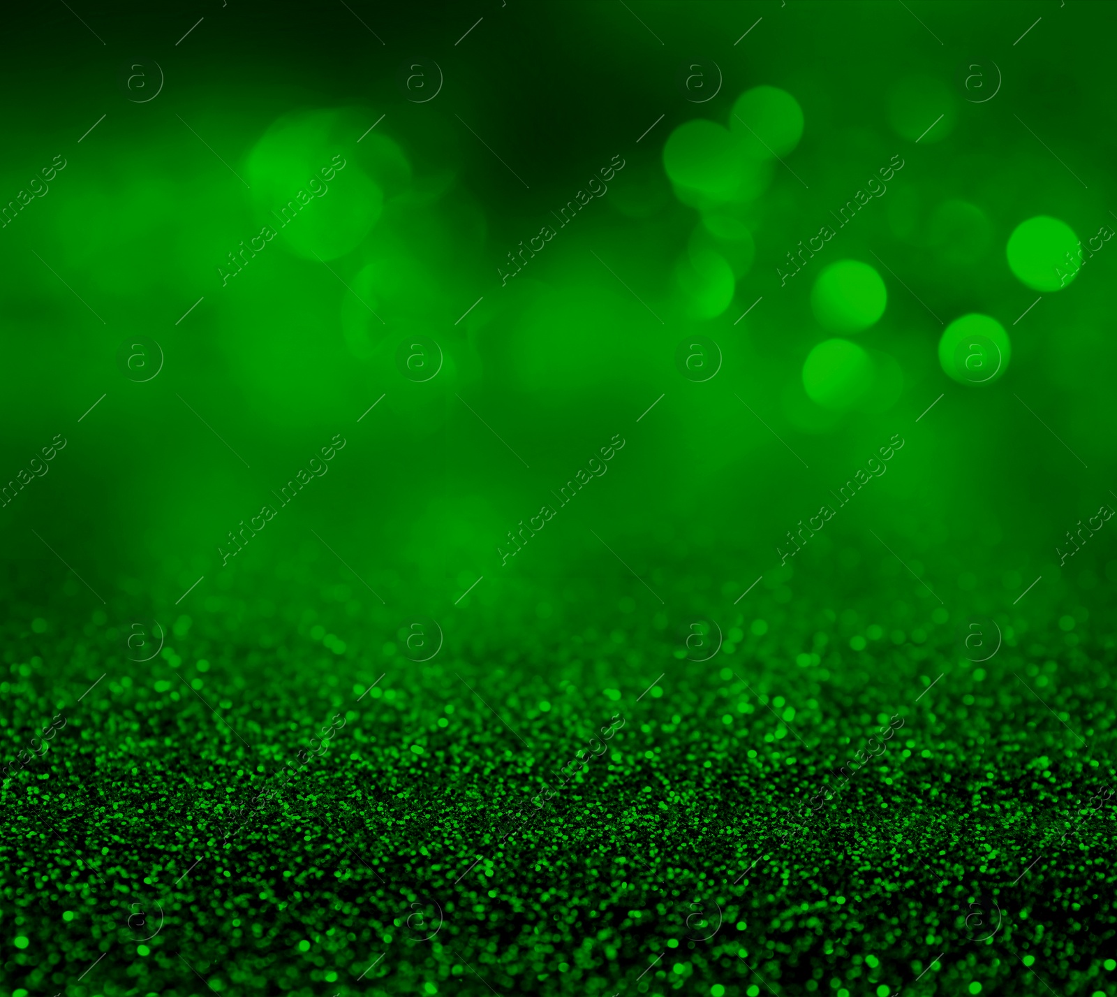 Image of St. Patrick day. Shiny green glitter, closeup. Bokeh effect