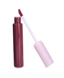 Bright lip gloss and applicator isolated on white