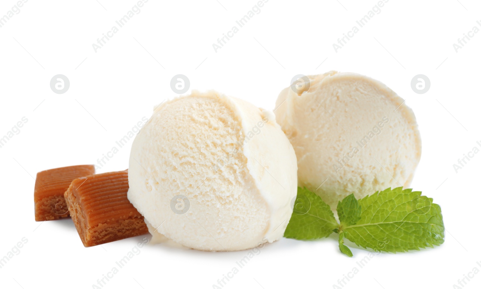 Photo of Delicious ice cream with caramel candies and mint on white background