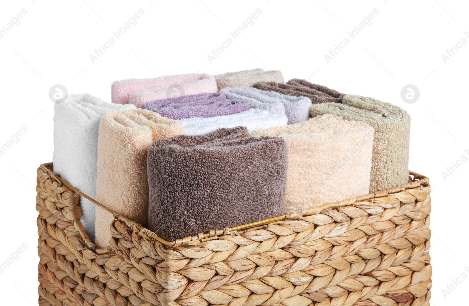 Photo of Wicker laundry basket with clean terry towels isolated on white