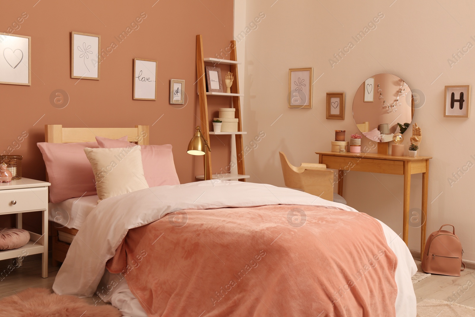 Photo of Teenage girl's bedroom interior with stylish furniture and beautiful decor elements