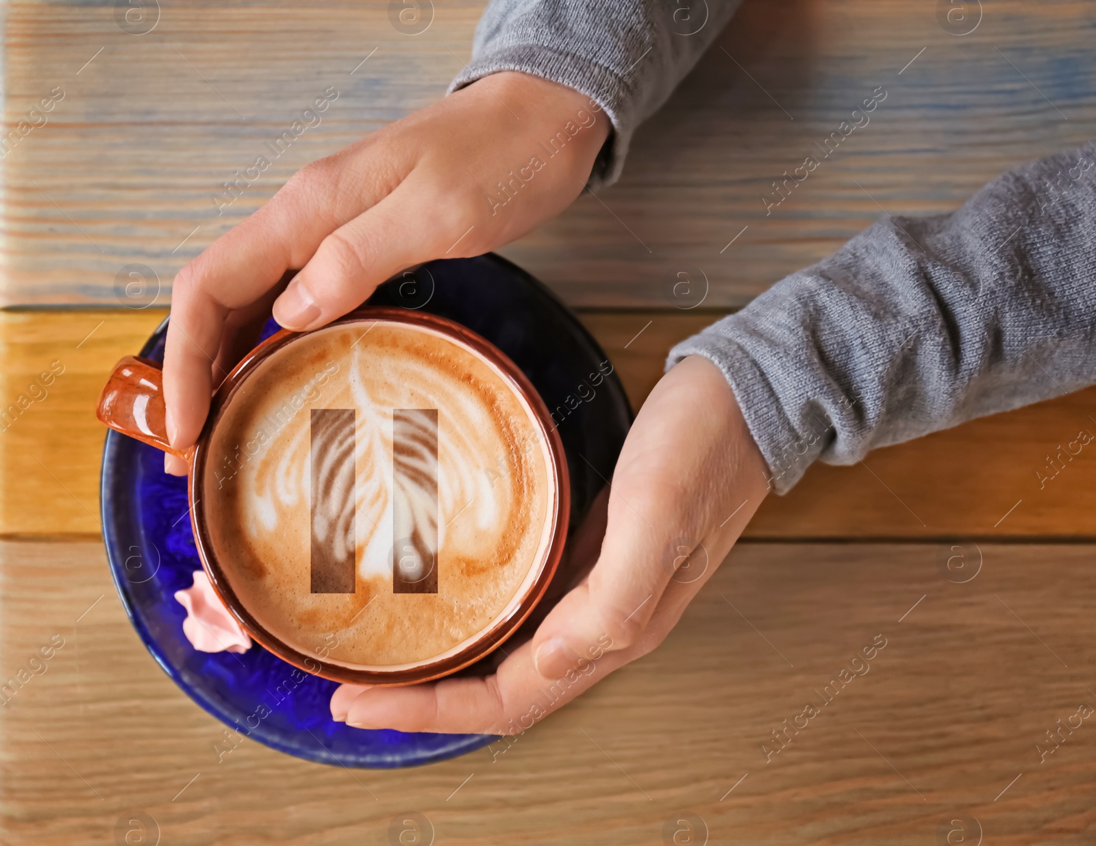 Image of Coffee Break. Woman with cup of cappuccino at wooden table, top view