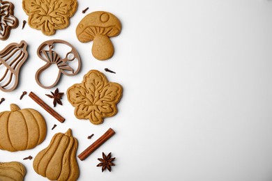 Photo of Flat lay composition with tasty cookies, cutters and spices on white table. Space for text
