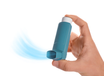 Image of Man holding asthma inhaler with steam on white background, closeup