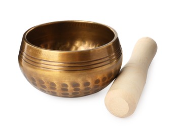 Photo of Golden singing bowl with mallet on white background. Sound healing