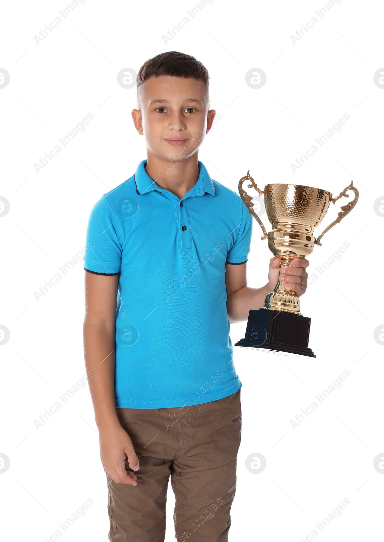 Photo of Happy boy with golden winning cup on white background