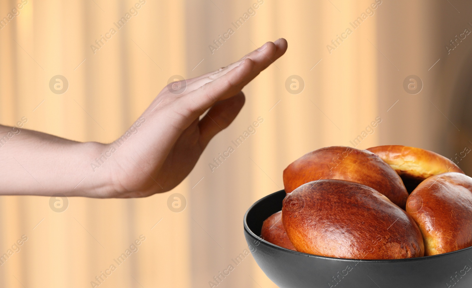 Image of Gluten free diet. Man refusing from pastry at home, closeup