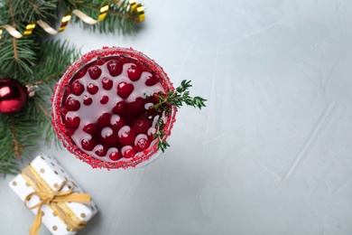 Delicious Christmas cocktail with liqueur on light table, flat lay. Space for text
