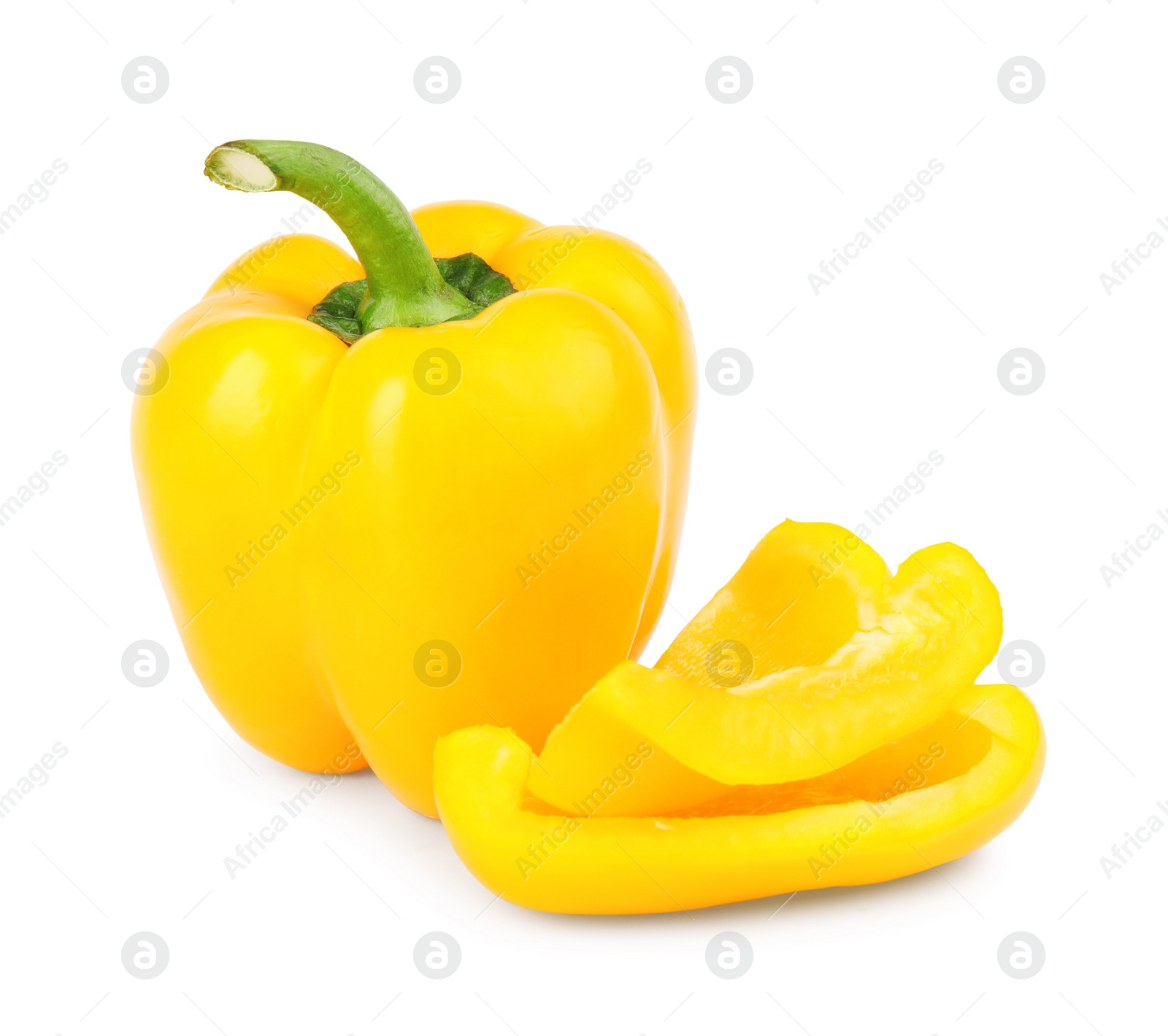 Photo of Whole and cut yellow bell peppers isolated on white