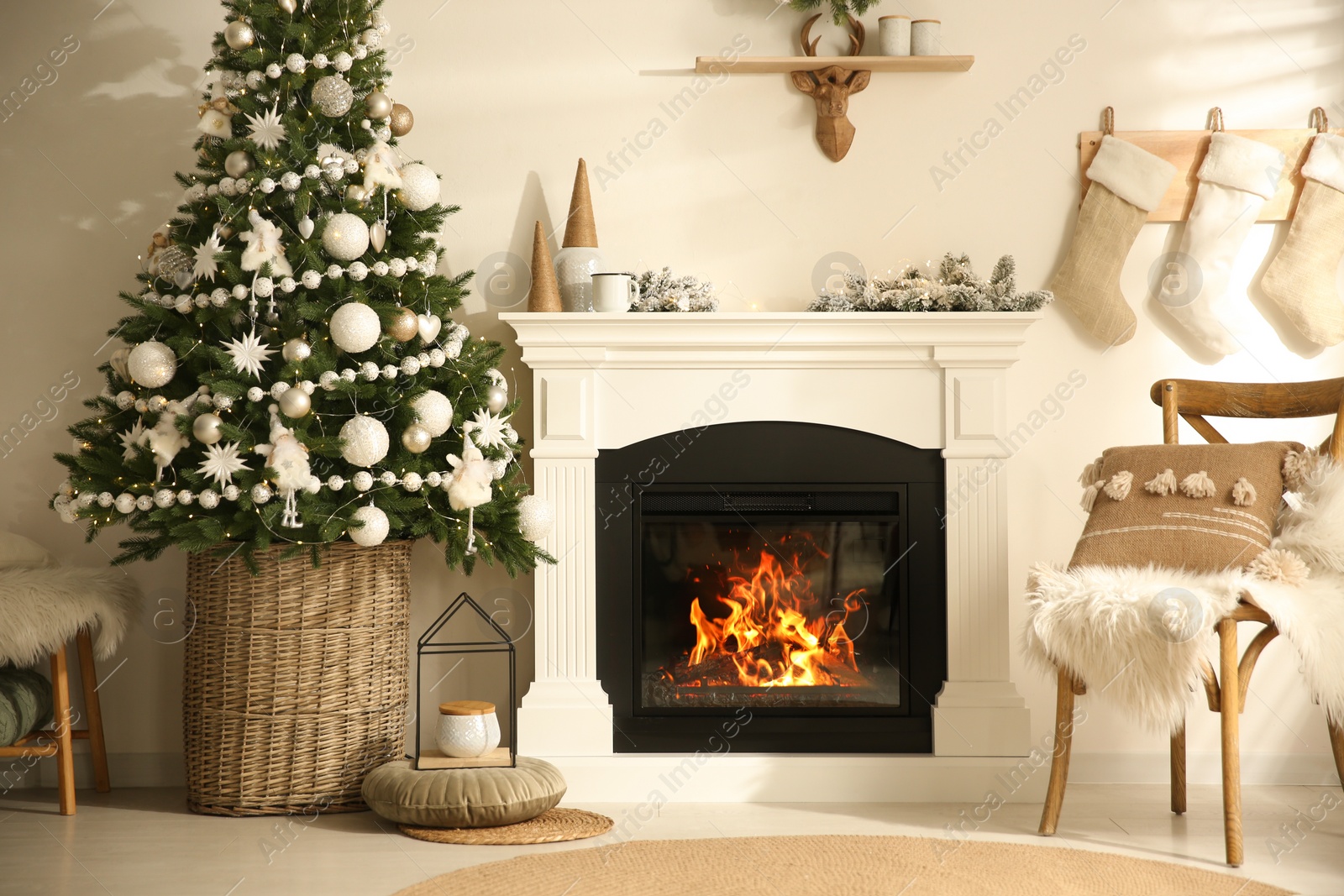 Photo of Beautiful living room interior with decorated Christmas tree and modern fireplace