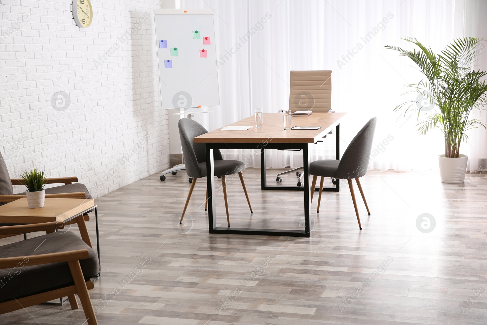 Photo of Interior of modern office with table and chairs