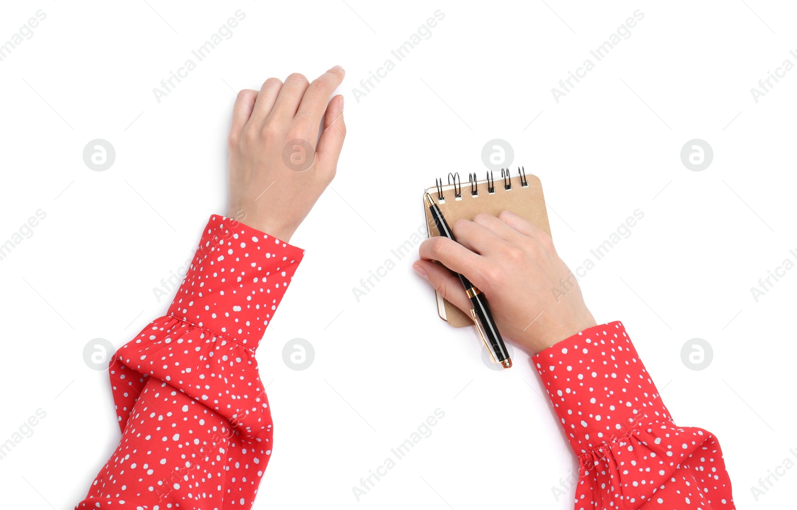 Photo of Woman holding pen and notebook on white background, top view