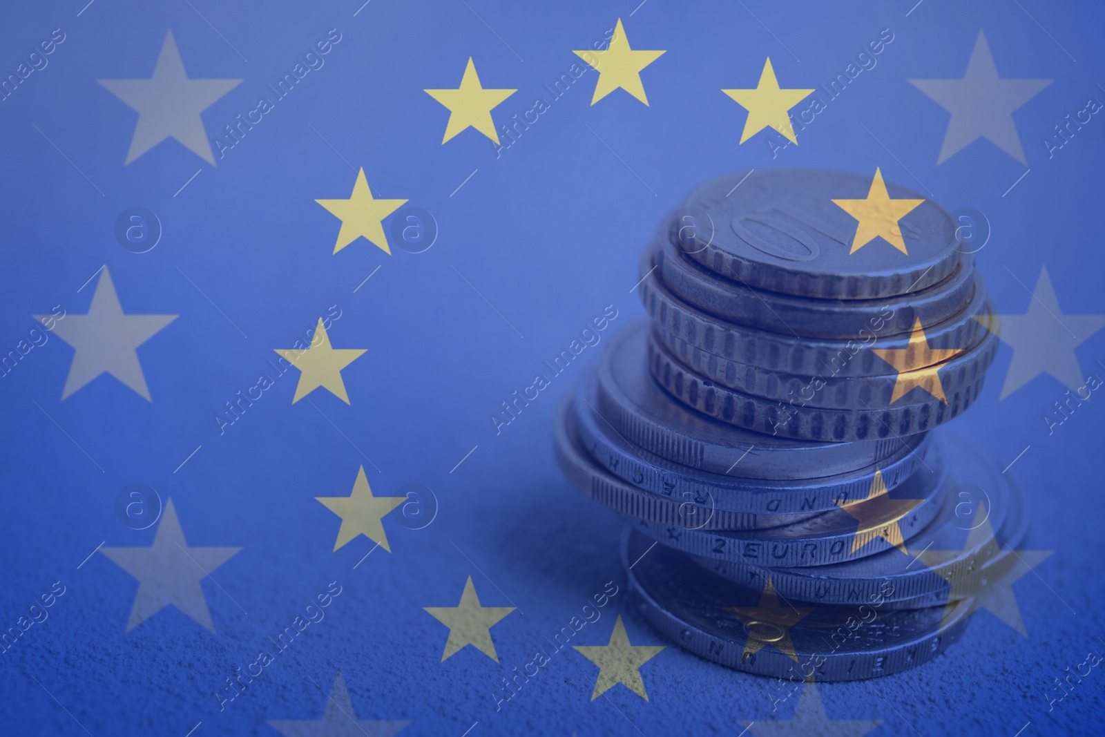 Image of Double exposure of European Union flag and coins on table, closeup view