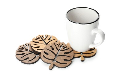 Mug and stylish wooden coasters on white background