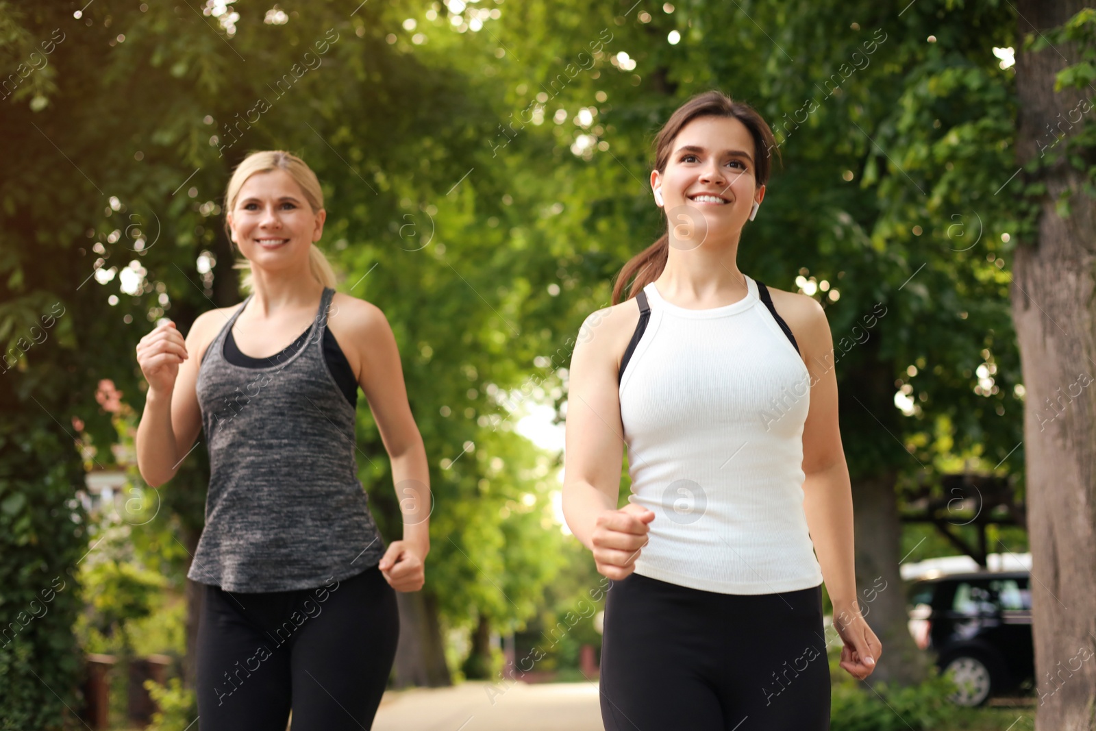 Photo of Women running on city street in morning