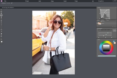 Professional photo editor application. Image of young woman in sunglasses with stylish black bag